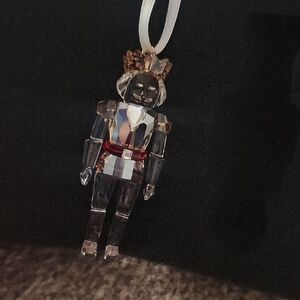 Swarovski Festive Nutcracker Ornament with Red and Gold Accents